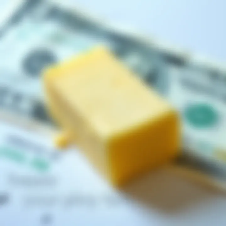 A stick of butter placed on a dollar bill, symbolizing the relationship between currency value and commodity prices