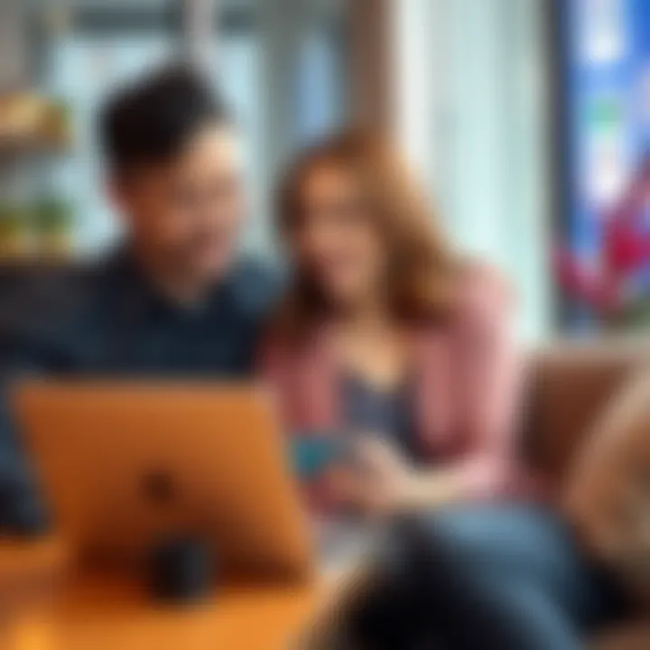 A couple discussing finances while looking at a Revolut card on a laptop