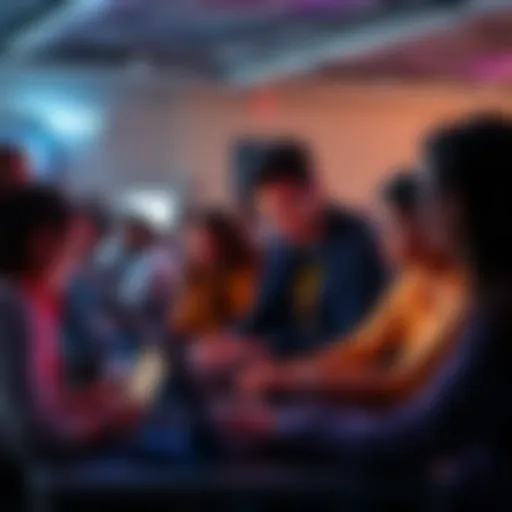 Group of people collaborating on laptops during a hackathon event