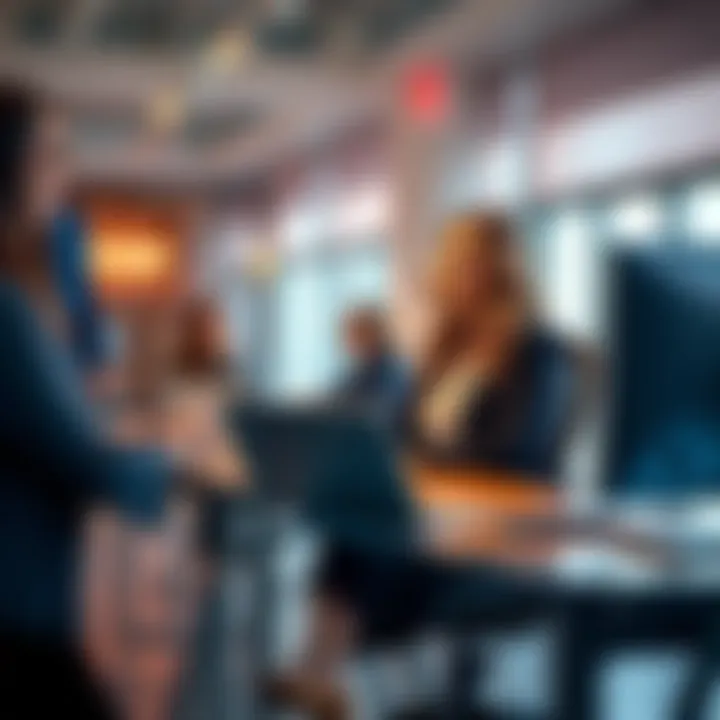 Hannah Noyes seated at her desk in a modern office, confidently discussing marketing strategies with her team.