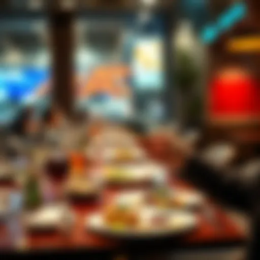 A person using a credit card at a restaurant table with food and drinks