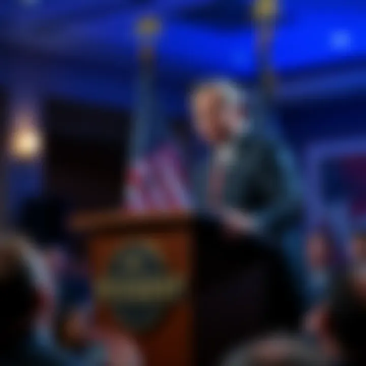 U.S. Treasury Secretary Bessent stands at a podium with the American flag, speaking about legislation for the cryptocurrency market, with an audience in the background.